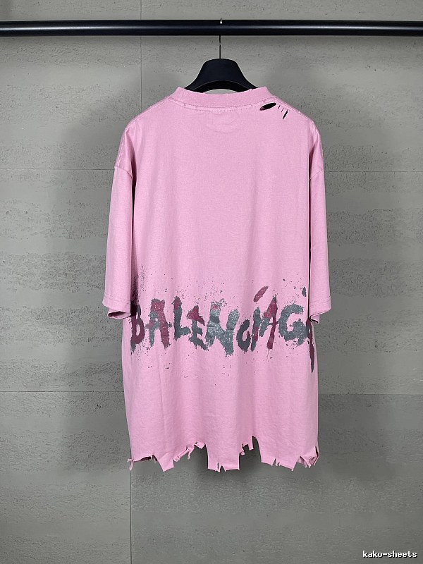 Balenciaga's pink T-shirt with a hole and graffiti style