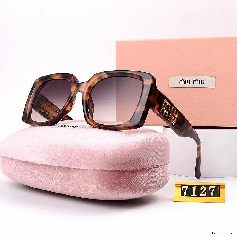 Miu Miu Relaxed Oversized sunglasses Black Oval Sunglasses with Designer-Inspired Detail